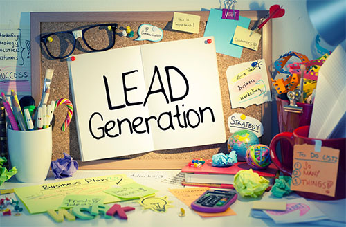 An idea board filled with sticky notes and a large sign with the message "lead generation" sits on top of a desk.