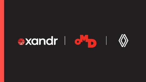 Xandr logo on the left and OMD Spain logo on the right over a black background.